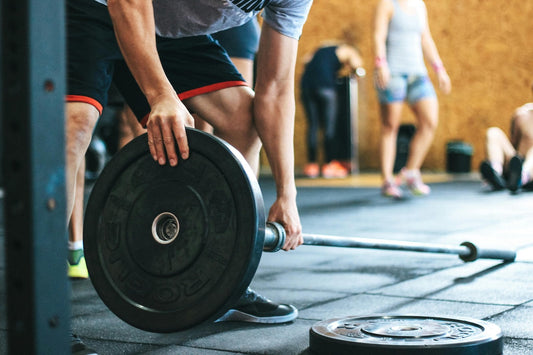 Person preparing for a weightlifting session, illustrating gym lingo explained in a fun context