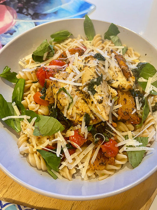 Delicious fitness-friendly pasta recipes with rotini, grilled chicken, cherry tomatoes, and fresh spinach