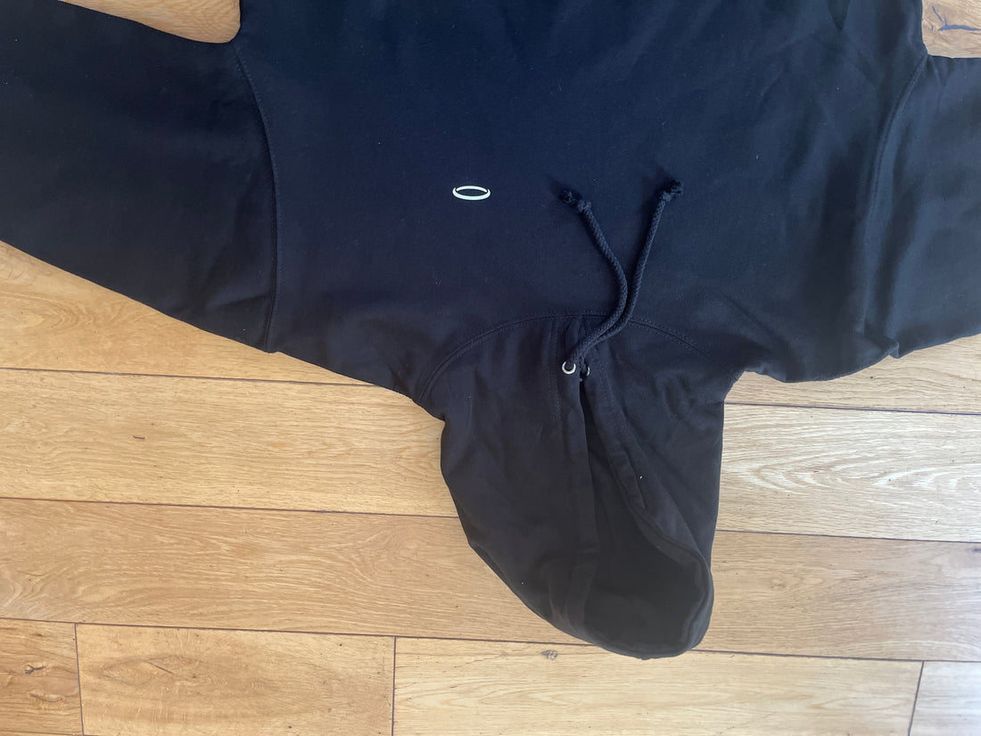 Black hoodie showcasing sportswear fabrics guide focused on moisture-wicking and breathability