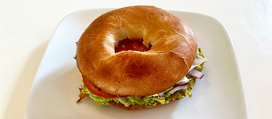 Avocado Power Bagel recipe featuring a toasted bagel topped with fresh veggies and avocado spread