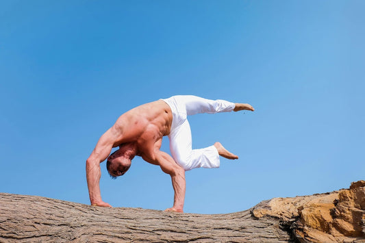 Muscular man balancing on hands outdoors illustrating what is protein and why it matters for fitness