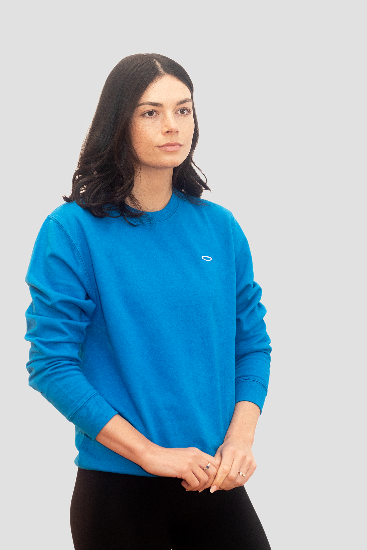 Model wearing a Women’s sapphire sports sweatshirt in vibrant blue for active lifestyle and comfort