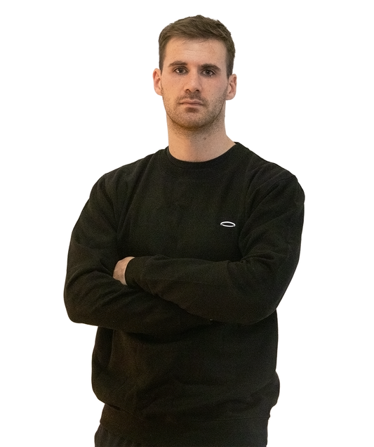 A man, arms folded, wearing a Bodydisciple black sweatshirt B24D021BLK_Men_1