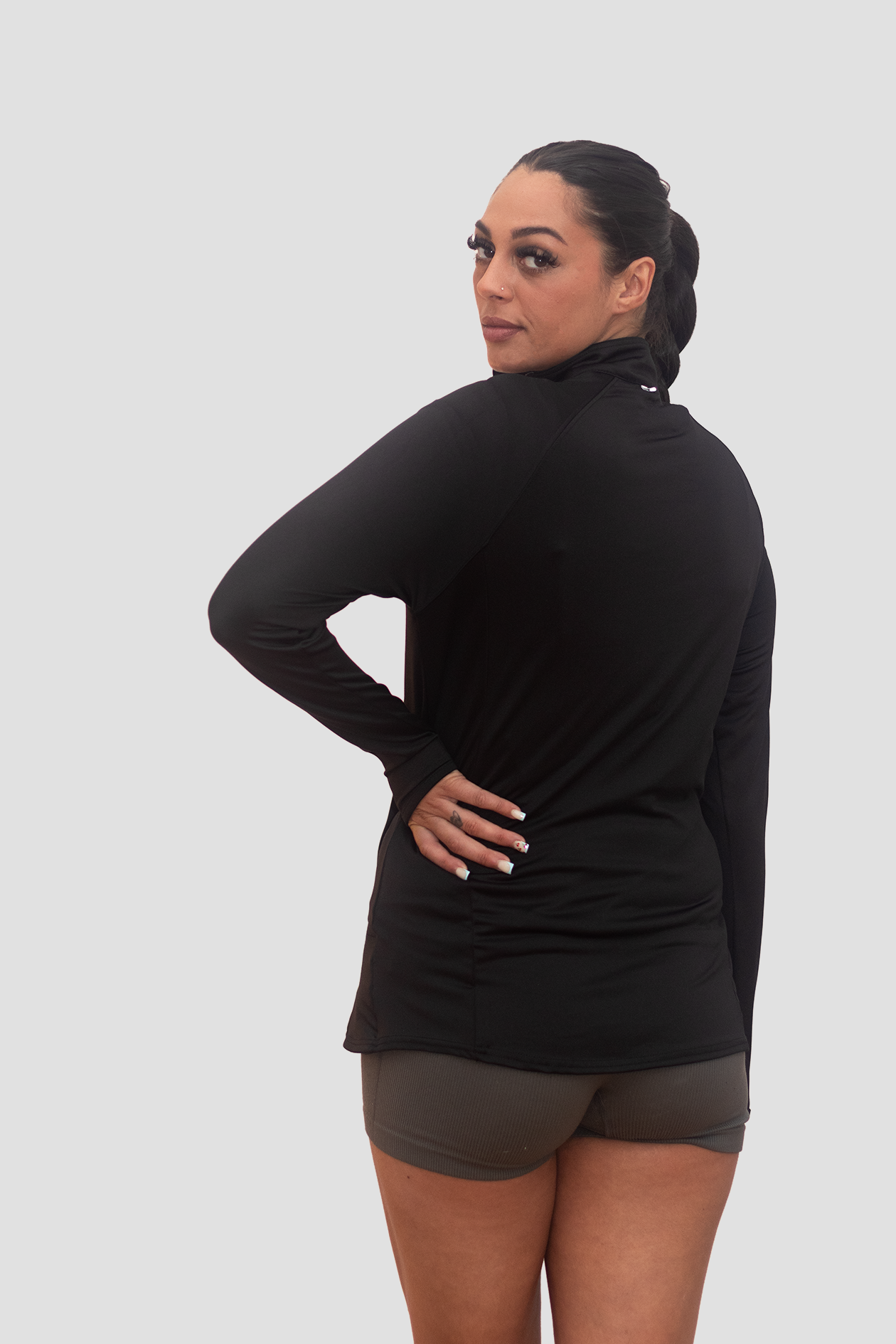 Woman wearing a Bodydisciple Zip Top_B24D221BLK_2