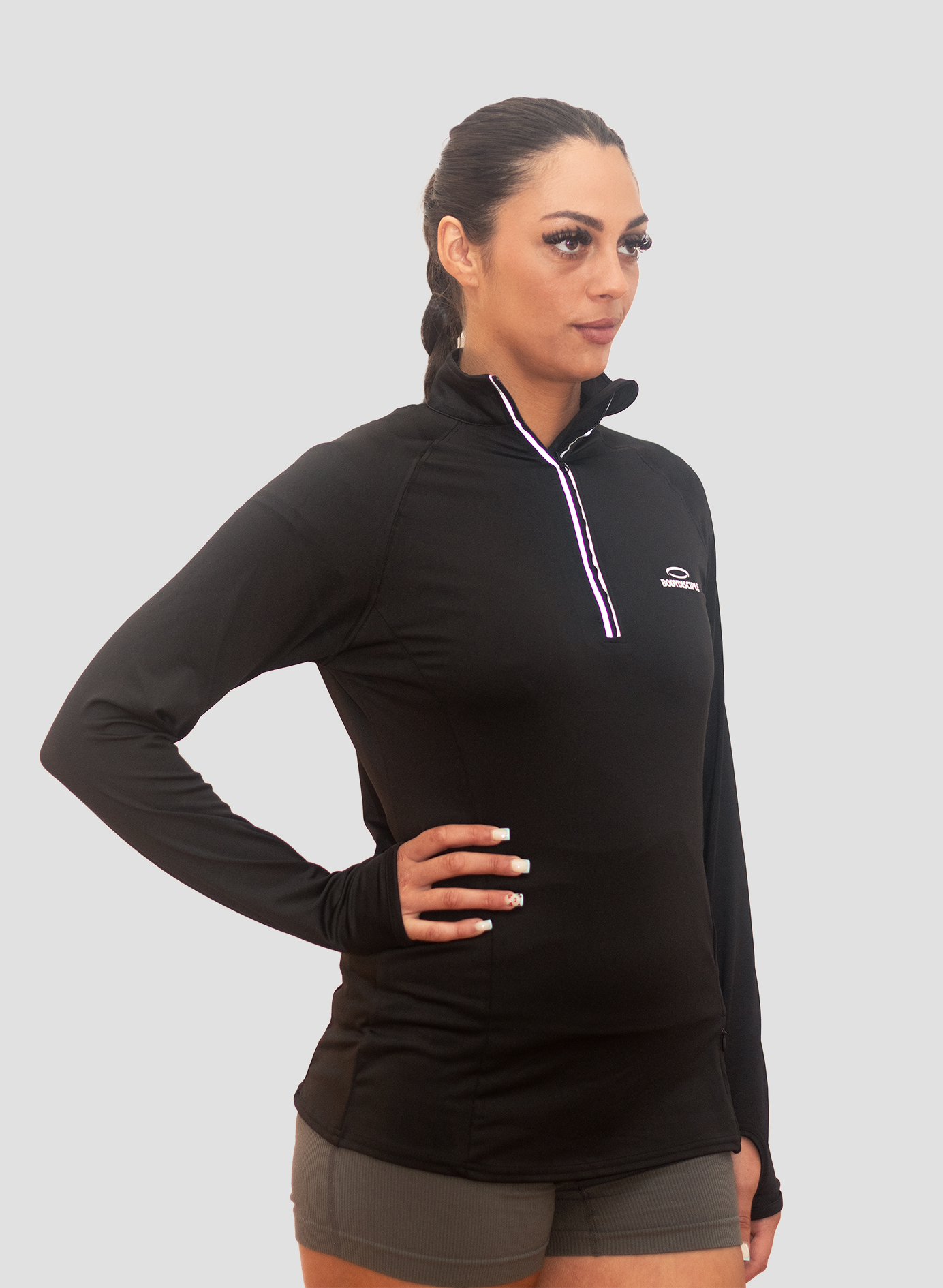 Woman wearing a Bodydisciple Zip Top_B24D221BLK_4